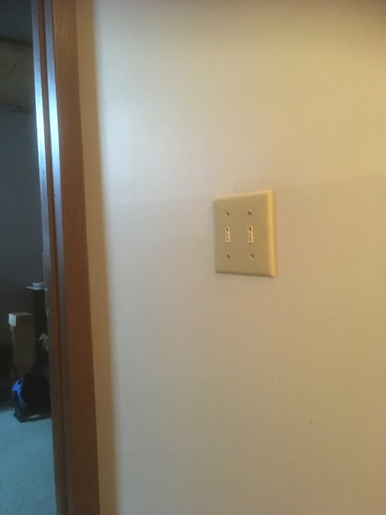 Two Touchless Light Switches at the bottom of the basement stairs